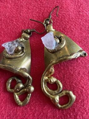 Handmade earrings, likely copper and stone